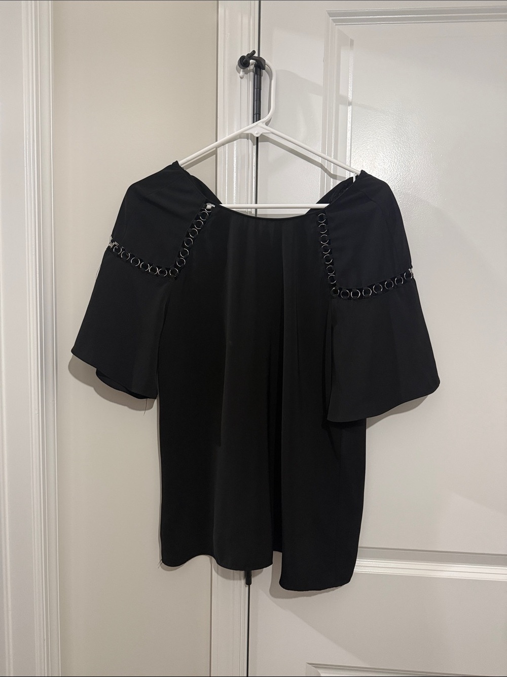 Off-Shoulder Black Top with Bell Sleeves and Ring Trim